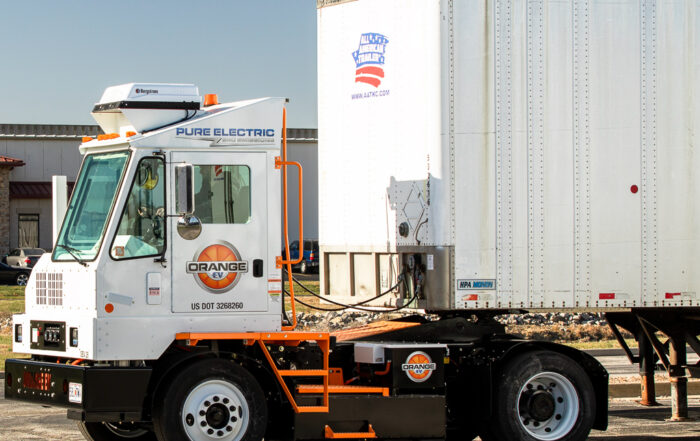 White electric yard truck with trailor