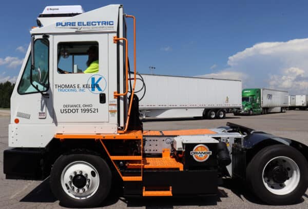 A white Orange EV Electric Yard Truck