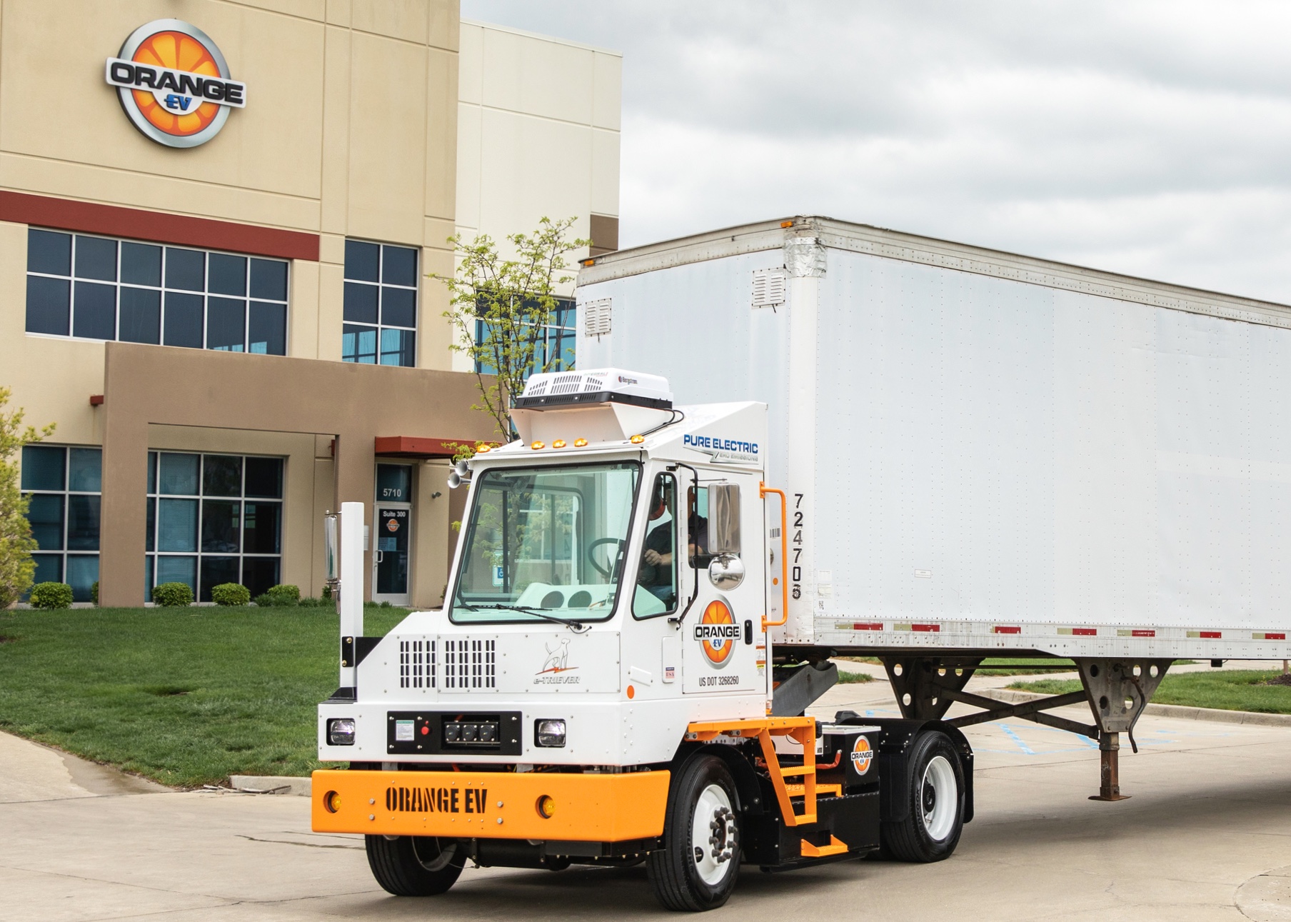 e-TRIEVER trailer electric truck in white and orange manufactured by Orange EV